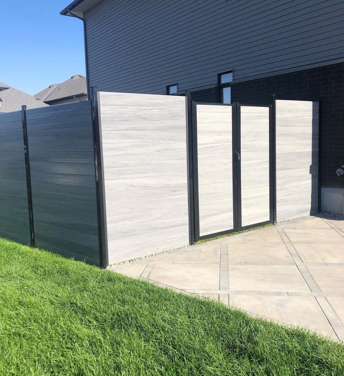 Modern grey composite privacy fence and gate